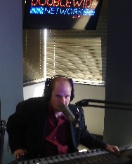 Top-Talk-Show-Host-Josh-Bernstein-on-air-double-wide.jpg